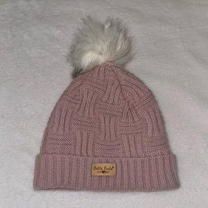 Pink winter hat with white puffball